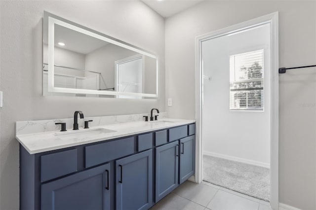 bathroom featuring tile patterned floors and vanity