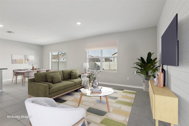 living room with tile patterned flooring