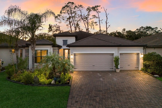 prairie-style house featuring a garage