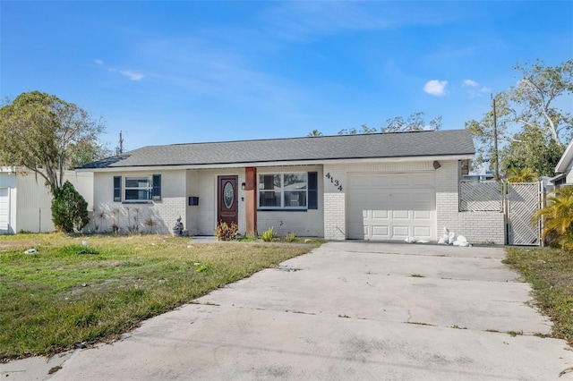 single story home with a garage and a front yard