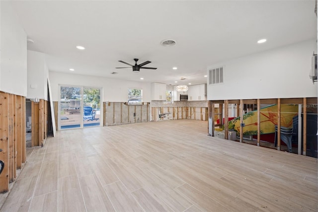 interior space featuring light hardwood / wood-style floors and ceiling fan