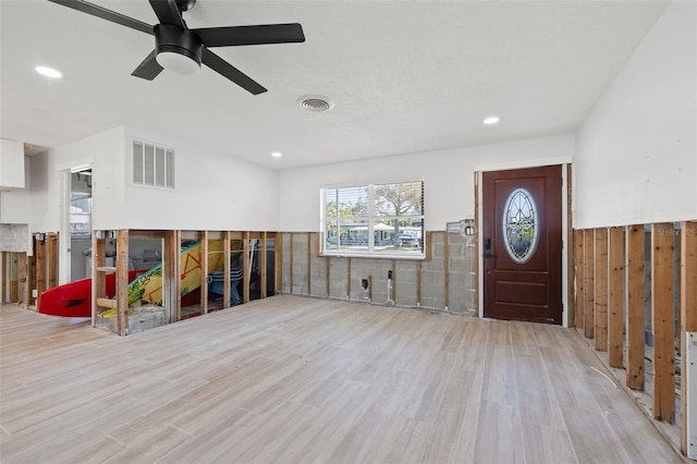 foyer entrance featuring ceiling fan and light hardwood / wood-style floors