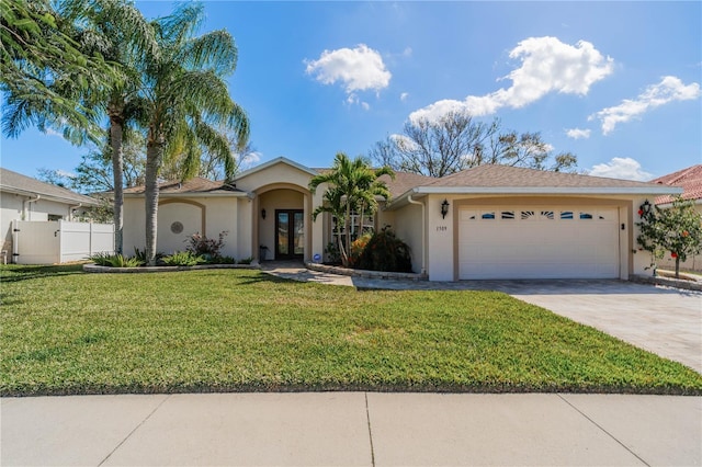 single story home with a garage and a front lawn