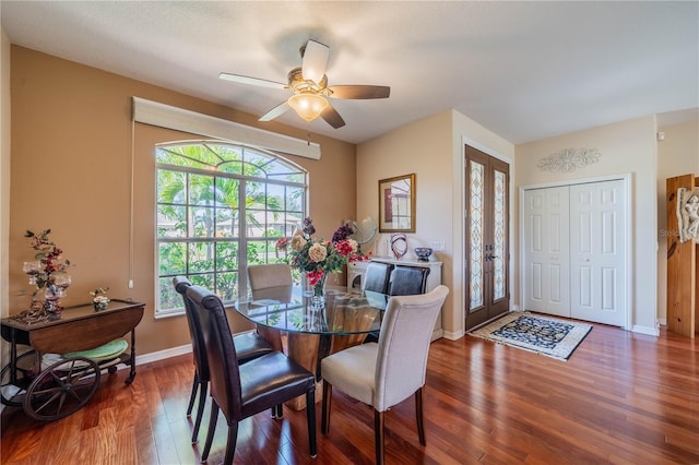 dining area featuring dark wood-type flooring, french doors, and ceiling fan