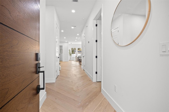 hallway featuring light parquet floors