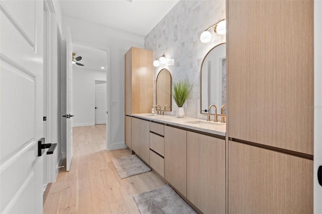 bathroom featuring wood-type flooring and vanity