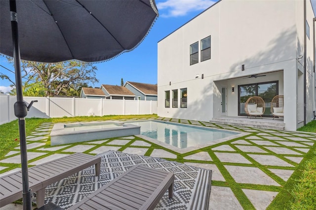 view of swimming pool with a patio and ceiling fan