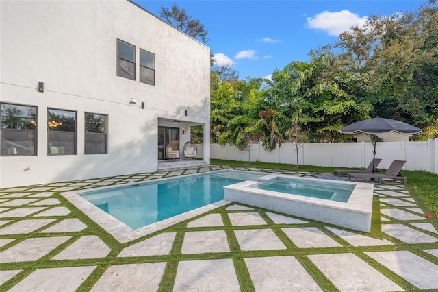 view of swimming pool with an in ground hot tub and a patio