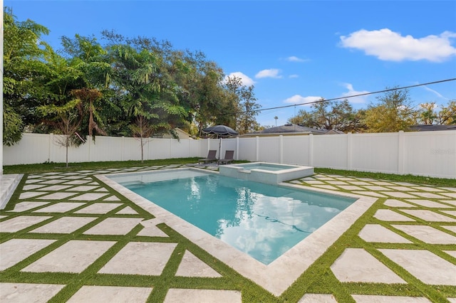 view of swimming pool featuring an in ground hot tub and a patio