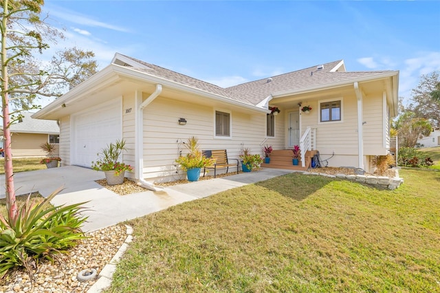 ranch-style home with a garage and a front yard