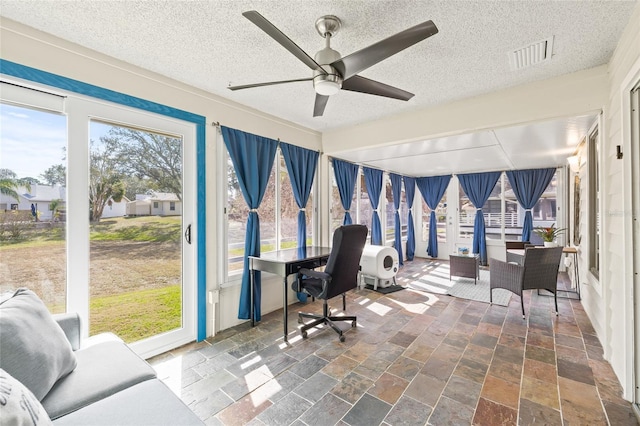 1007 Lake Avoca Dr, Tarpon Springs, FL 34689 - home office with ceiling fan and a textured ceiling