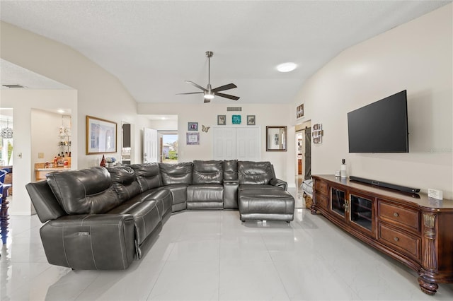 1007 Lake Avoca Dr, Tarpon Springs, FL 34689 - living room featuring a textured ceiling, vaulted ceiling, and ceiling fan