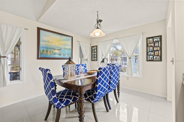 1007 Lake Avoca Dr, Tarpon Springs, FL 34689 - tiled dining area with a textured ceiling