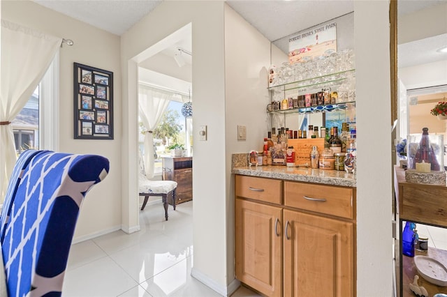1007 Lake Avoca Dr, Tarpon Springs, FL 34689 - bar with light tile patterned flooring and a textured ceiling