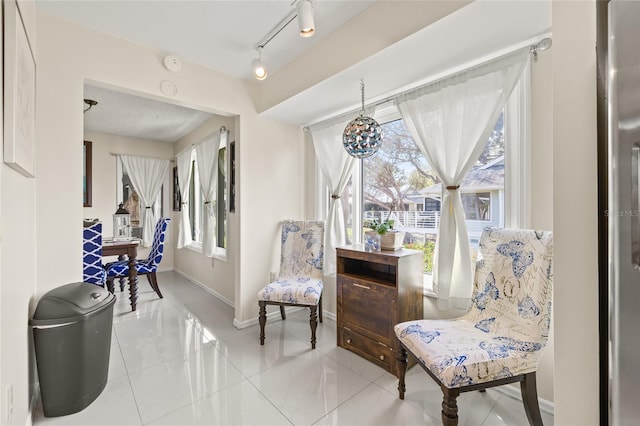 1007 Lake Avoca Dr, Tarpon Springs, FL 34689 - living area with track lighting and a healthy amount of sunlight