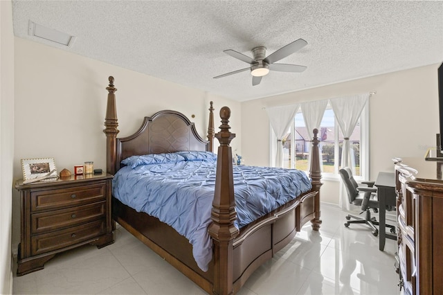 1007 Lake Avoca Dr, Tarpon Springs, FL 34689 - tiled bedroom with a textured ceiling and ceiling fan