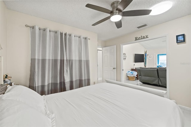 1007 Lake Avoca Dr, Tarpon Springs, FL 34689 - bedroom with ceiling fan and a textured ceiling