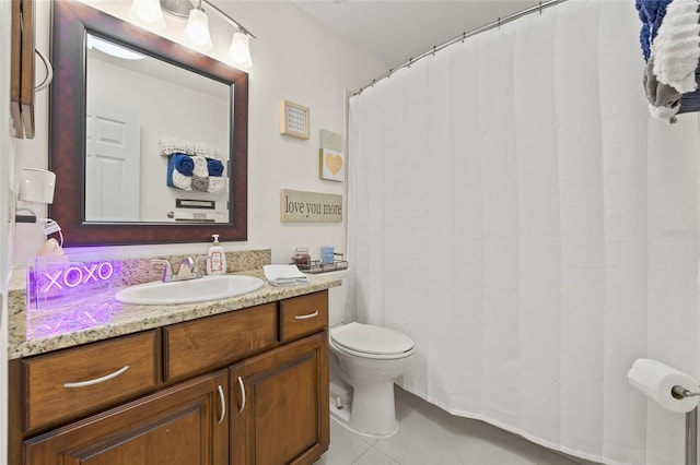 1007 Lake Avoca Dr, Tarpon Springs, FL 34689 - bathroom with tile patterned floors, vanity, and toilet