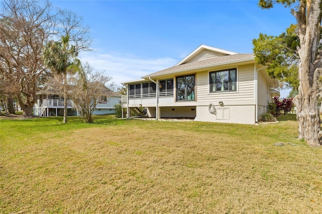 1007 Lake Avoca Dr, Tarpon Springs, FL 34689 - rear view of house featuring a yard and a sunroom