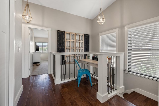 office with lofted ceiling and dark hardwood / wood-style flooring