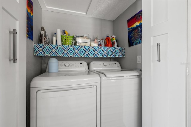 washroom featuring washer and clothes dryer