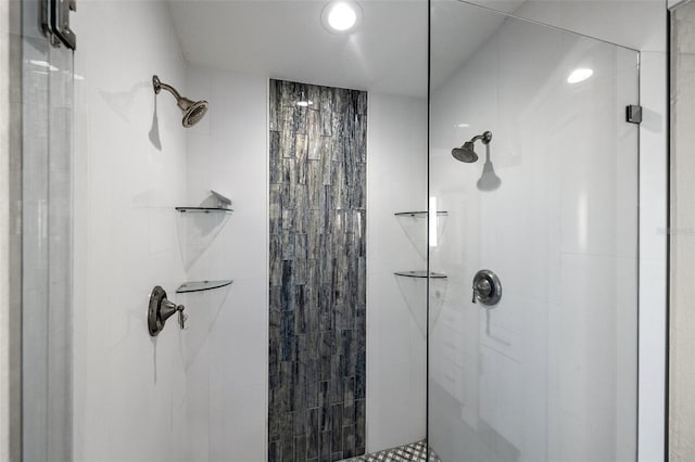 bathroom with tiled shower