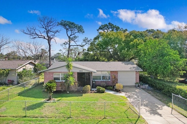 single story home with fence private yard, a front lawn, concrete driveway, and brick siding