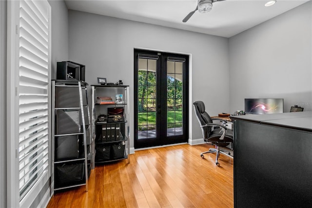 office area with hardwood / wood-style flooring, ceiling fan, and french doors