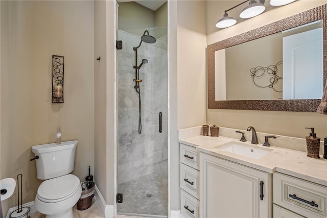 bathroom featuring vanity, toilet, and walk in shower