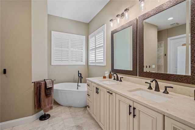 bathroom with vanity and a bathtub