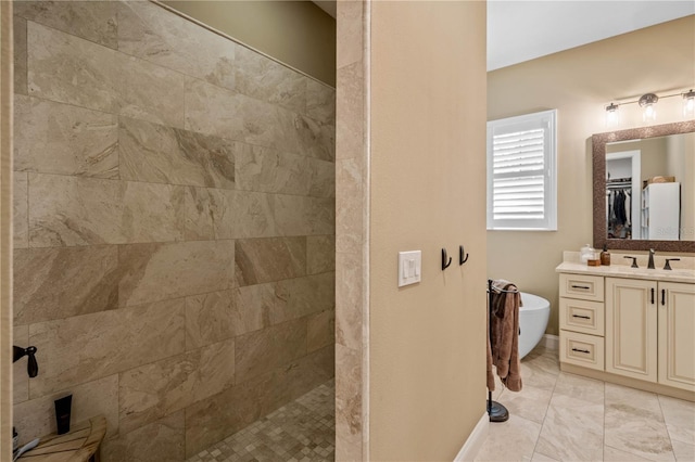 bathroom with vanity and tiled shower