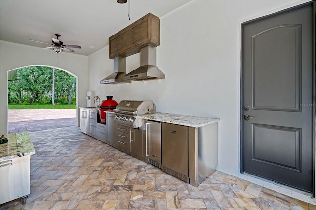 view of patio featuring area for grilling, sink, and ceiling fan