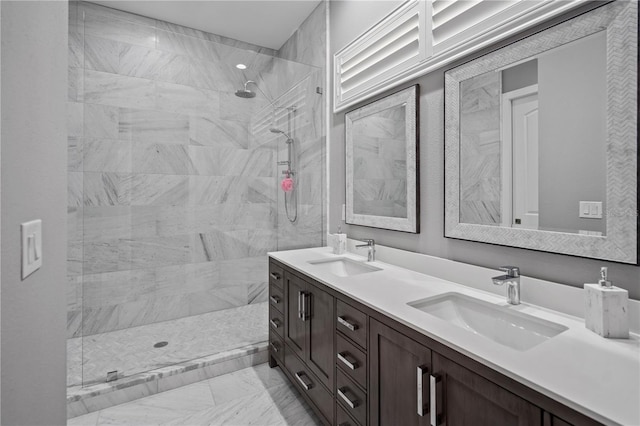 bathroom featuring vanity and a tile shower