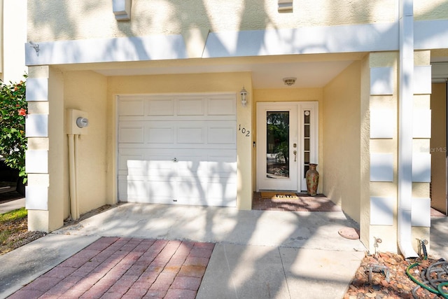 doorway to property featuring a garage