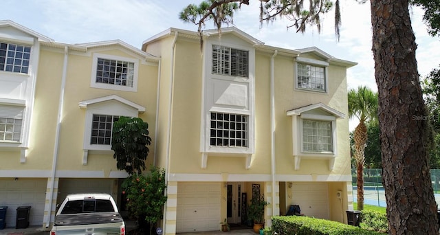 102 Brent Cir, Oldsmar, FL 34677 - multi unit property featuring stucco siding and a garage