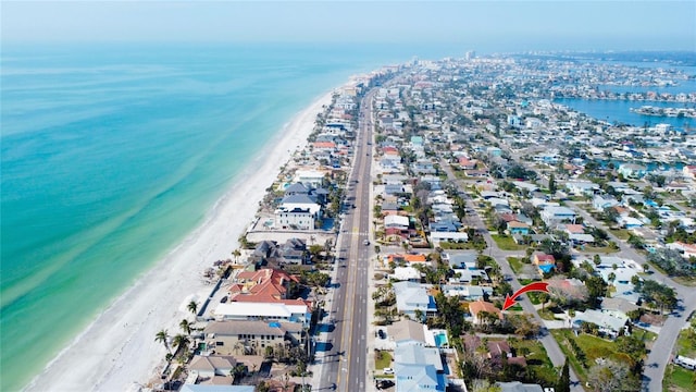 birds eye view of property with a view of the beach and a water view