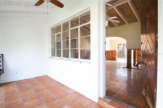 interior space with ceiling fan