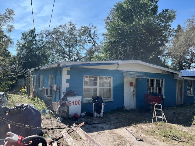 view of front of house featuring cooling unit