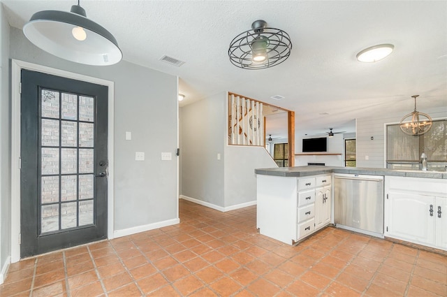 kitchen with sink, decorative light fixtures, dishwasher, kitchen peninsula, and white cabinets