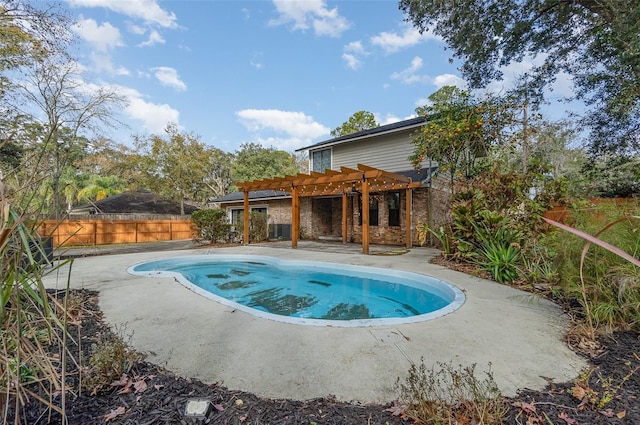 view of swimming pool featuring a pergola and a patio area