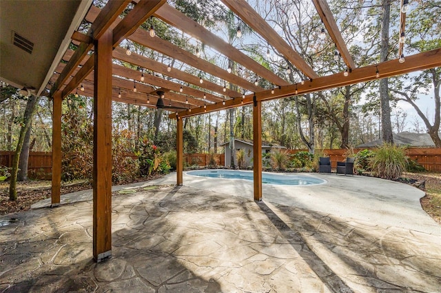 view of patio / terrace with an outbuilding, a fenced in pool, and a pergola