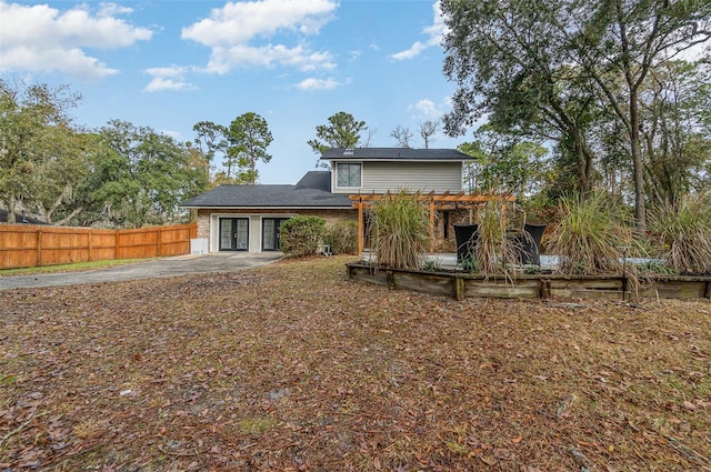 back of house with a pergola