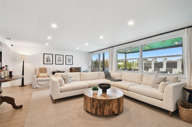 living room with light hardwood / wood-style flooring