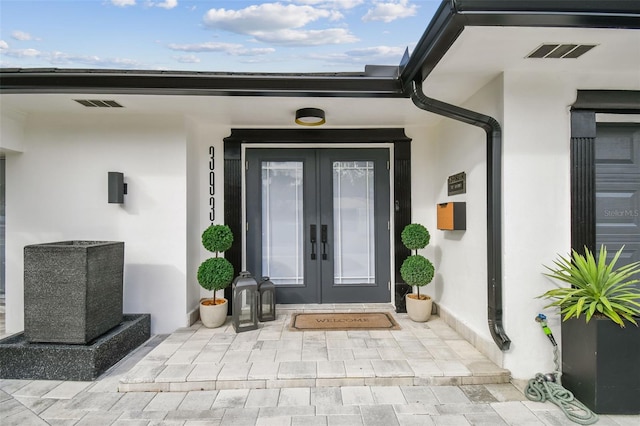 view of exterior entry with french doors