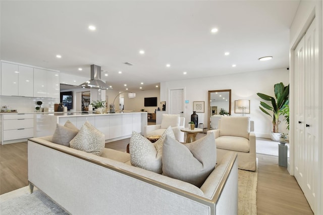 living room with light hardwood / wood-style floors