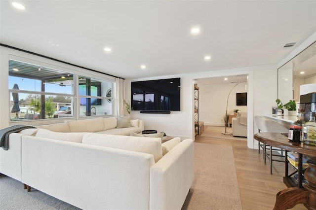 living room with light hardwood / wood-style floors