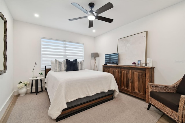 carpeted bedroom featuring ceiling fan