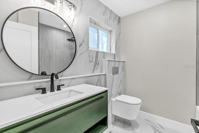 bathroom with vanity, toilet, and tiled shower