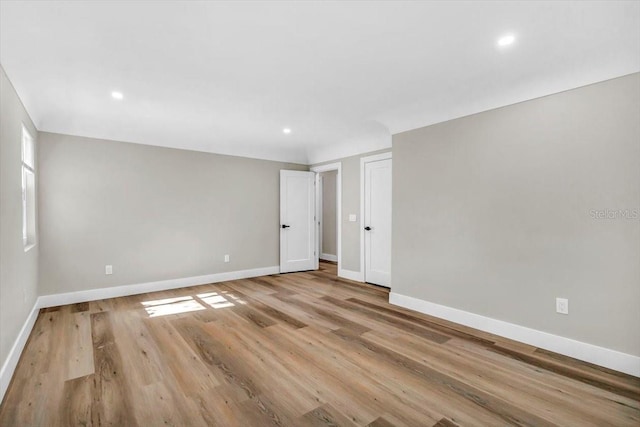 unfurnished room featuring light hardwood / wood-style flooring