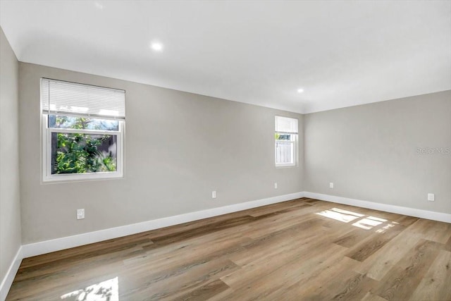 spare room with light wood-type flooring